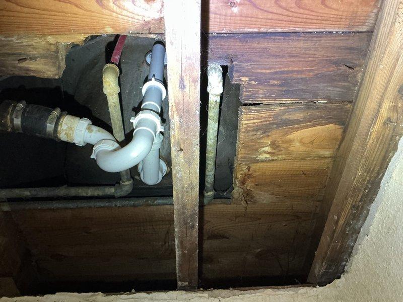 Conducted comprehensive whole-home replumbing assessment in response to free estimate request. Inspected existing plumbing infrastructure throughout property, including crawl space and basement areas, documenting current piping conditions. Evaluated aging copper supply lines, white PVC drain-waste-vent system, and blue PEX water distribution lines running through floor joists and ceiling cavities. Identified mixed-age plumbing materials requiring replacement, including deteriorated metallic piping and older PVC connections with visible wear. Assessed structural penetrations through wooden floor joists and concrete block foundation walls, noting proper clearances and support bracket installations. Photographed existing pipe routing, junction points, and accessibility for future replumbing work. Provided detailed estimate for complete residential replumbing project to modernize water distribution system and ensure code compliance.