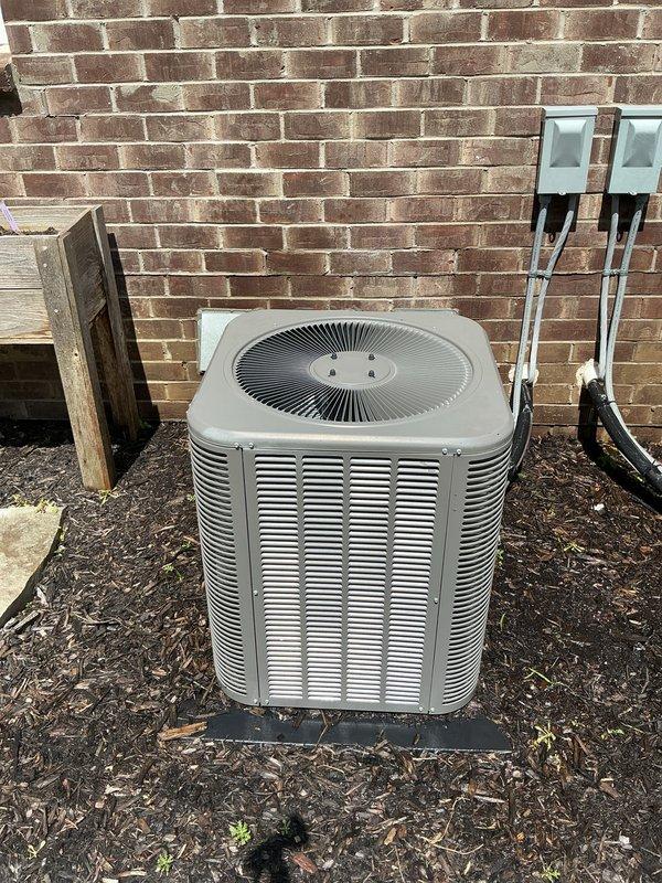 Completed comprehensive Gold AC Inspection on a 6-year-old Lennox air conditioning system with air handler located in basement. Performed full system evaluation including condenser unit inspection, verified proper operation of outdoor unit with fan grille and louvered cabinet panels, checked electrical connections and disconnect boxes mounted on exterior wall, confirmed unit is properly mounted on concrete pad with adequate clearance, and verified surrounding area is clear of debris with mulch landscaping maintained appropriately. System is operating as designed with no deficiencies noted during inspection.