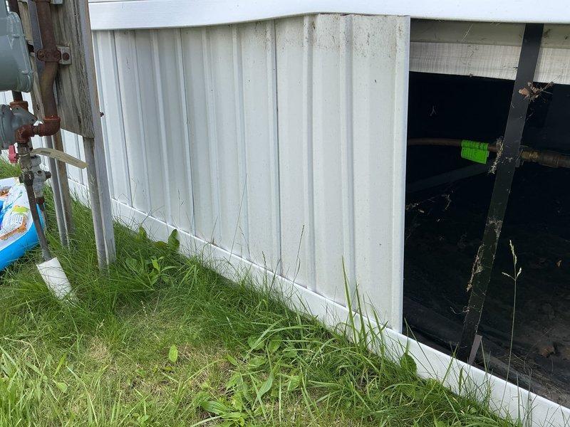 Responded to exterior gas line break affecting specific area of property. Accessed crawl space beneath structure where corroded copper gas line was located. Inspected damaged section of horizontal gas line showing significant oxidation and surface deterioration. Repaired broken gas line section, replaced corroded piping, and secured new line with proper mounting brackets. Tagged repaired section per safety protocols. Verified system integrity and tested for leaks upon completion.