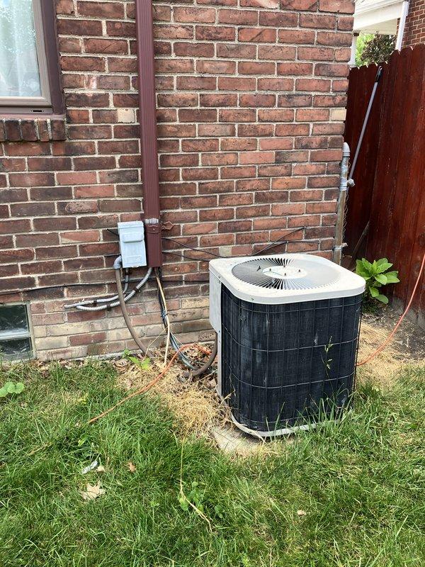 Completed comprehensive estimate for full replacement of existing space pack HVAC system located in attic. Current unit has exceeded twenty-year service life and requires complete replacement. Assessed attic-mounted equipment accessibility and confirmed ladder access required for installation. Evaluated existing outdoor condensing unit positioned on concrete pad adjacent to building exterior, noting electrical disconnect and conduit routing along brick wall. Inspected electrical service connection point at meter location to verify adequate power supply for new system installation. Documented current system configuration and provided homeowner with replacement options and upgrade recommendations for improved efficiency and performance.