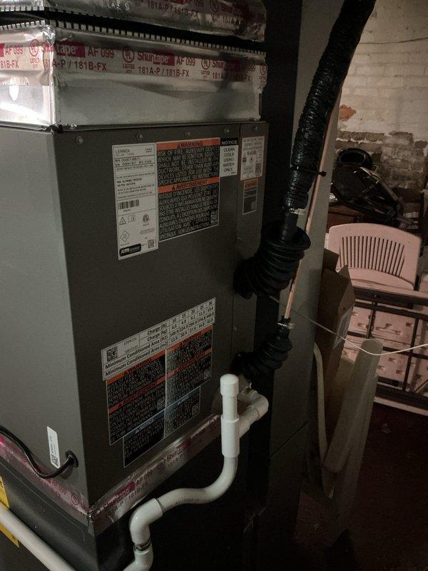 Completed installation of 2.5 ton air conditioning system with matching evaporator coil in basement utility area with rear discharge configuration. Installed new air handler unit, established condensate drainage system with PVC piping, connected flexible ductwork to existing distribution system, and coordinated new dedicated electrical circuit installation. All mechanical, electrical, and air conditioning permits were obtained and system was commissioned for proper operation.