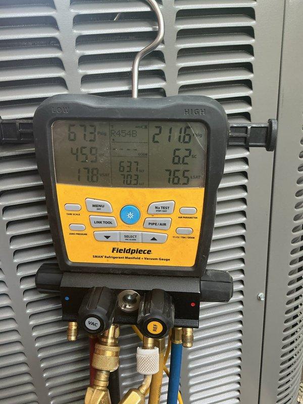 Completed full HVAC system installation including a 70,000 BTU furnace and 2.5-ton air conditioning unit with rear discharge configuration. Installed new thermostat, humidifier, duct liner, and condensate pump, along with 500 feet of miscellaneous materials and 4x25 supply runs. Performed system evacuation and charged unit with R454B refrigerant to manufacturer specifications, verified proper pressures and temperatures across the system. Installed exterior PVC condensate drain line along brick foundation with proper slope and termination. Reconnected all electrical and mechanical connections, secured necessary mechanical and electrical permits for compliance. System tested and operational, with AHRI certificate number documented for utility rebate processing.