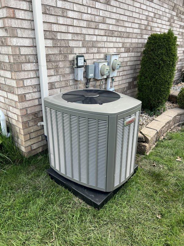 Completed installation of 3-ton air conditioning system with matching evaporator coil on left side of residence. Installed new outdoor condensing unit on rubber isolation pad, ran electrical disconnect and control wiring through weatherproof conduit along brick foundation, and reconnected all refrigerant lines and electrical connections. System tested and verified operational with proper airflow and cooling performance.