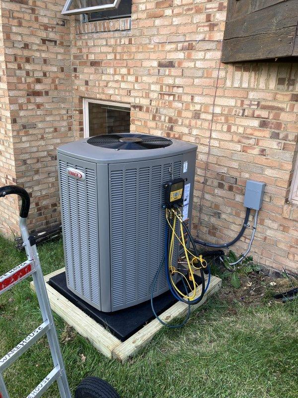 Completed full HVAC system replacement including installation of 110,000 BTU furnace and 4-ton Lennox air conditioning unit in left side yard location. Unit mounted on wooden platform base with rubber isolation pad against exterior brick wall. Connected yellow and black refrigerant lines, installed gray electrical disconnect box, and completed all electrical reconnections per code. Mechanical, electrical, and furnace permits obtained and work inspected. System registered with AHRI certification number for utility rebate qualification. Technician returned for follow-up visit to provide thermostat operation instruction and ensure customer comfort with new system controls.
