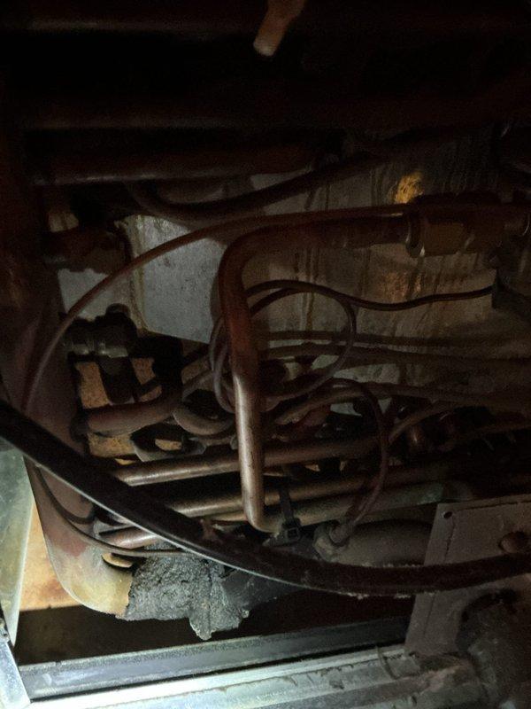 Responded to no-cool complaint on 12-year-old split system with both outdoor condenser and attic-mounted air handler/blower motor inoperative. Upon arrival, performed diagnostic evaluation of complete system including electrical components, compressor operation, and blower motor functionality. Accessed attic unit and exterior condenser to assess equipment condition and operational status. Documented existing equipment configuration with photographic evidence showing refrigerant line connections, ductwork installation, and overall system condition in attic space. Given the age of the equipment at 12 years and complete system failure affecting whole-house comfort, presented comprehensive replacement options for same-day installation as requested. Discussed benefits of full system replacement versus repair costs on aging equipment that has reached typical life expectancy. Customer approved complete HVAC system replacement. Removed existing 12-year-old outdoor condensing unit and attic air