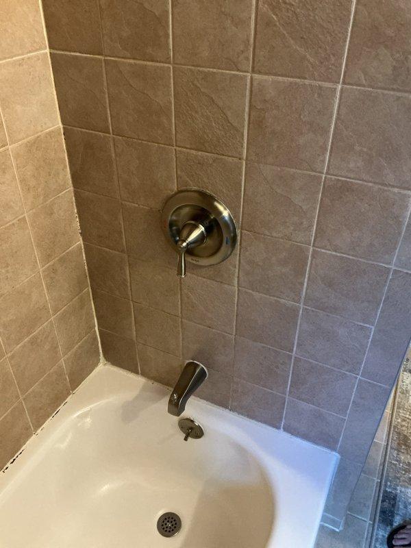 Performed complete hot water tank flush on basement-located unit to remove sediment buildup. Replaced shower faucet handle and showerhead in bathroom with updated chrome fixtures, ensuring proper water flow and temperature control. Replaced worn bathroom sink seats to eliminate leaks and restore proper valve function. All plumbing fixtures tested for proper operation and verified leak-free performance upon completion.