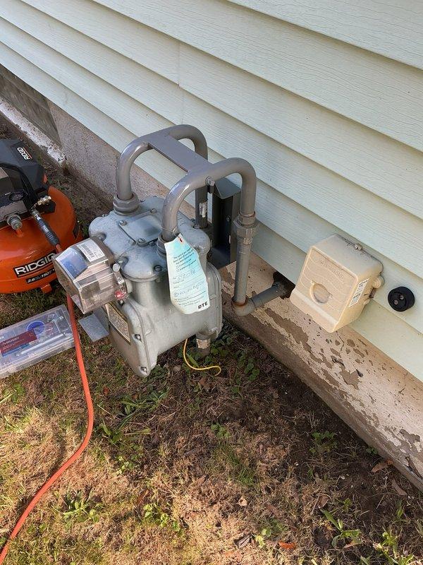 Responded to gas pressure concerns affecting entire residence in 70-year-old home. Performed comprehensive pressure test on gas line and meter assembly located in basement to identify potential leaks or pressure irregularities that had been present for approximately one week.

Conducted thorough inspection of gas piping system throughout basement area, examining exposed black iron pipe runs, joints, and connections along ceiling joists and support beams. Utilized pressure testing equipment to pressurize gas lines and monitor for pressure drops indicating leaks. Testing apparatus was set up at exterior gas meter location to isolate and test the complete system from meter through interior distribution lines.

Applied industry-standard pressure testing protocols, monitoring gauge readings over extended period to ensure system integrity. Inspected all visible pipe hangers, support clips, and connection points for proper installation and signs of deterioration consistent with age of home. D