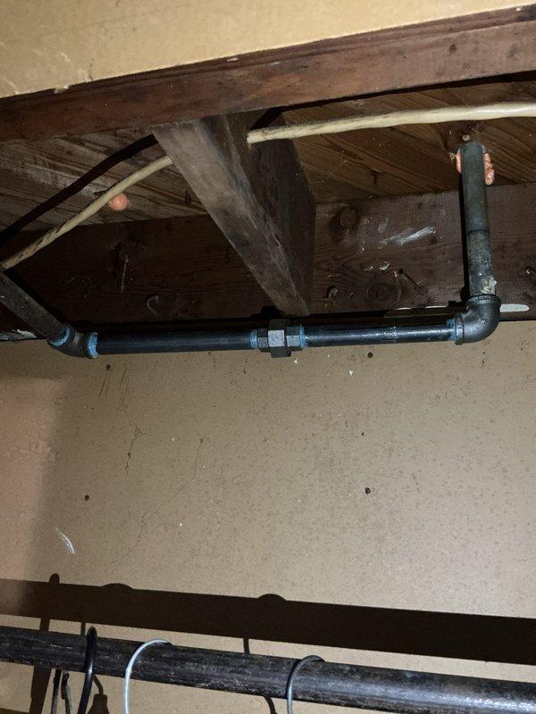 Responded to gas pressure concerns affecting entire residence in 70-year-old home. Performed comprehensive pressure test on gas line and meter assembly located in basement to identify potential leaks or pressure irregularities that had been present for approximately one week.

Conducted thorough inspection of gas piping system throughout basement area, examining exposed black iron pipe runs, joints, and connections along ceiling joists and support beams. Utilized pressure testing equipment to pressurize gas lines and monitor for pressure drops indicating leaks. Testing apparatus was set up at exterior gas meter location to isolate and test the complete system from meter through interior distribution lines.

Applied industry-standard pressure testing protocols, monitoring gauge readings over extended period to ensure system integrity. Inspected all visible pipe hangers, support clips, and connection points for proper installation and signs of deterioration consistent with age of home. D