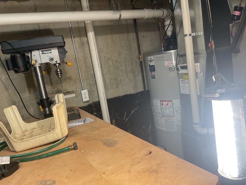 Responded to callback regarding extended hot water delivery time following 75-gallon power vent water heater installation. Inspected installation in basement mechanical room, verified all plumbing connections, PVC venting, and unit operation. Documented existing installation with photos showing proper mounting, code-compliant piping configuration, and manufacturer labeling intact.