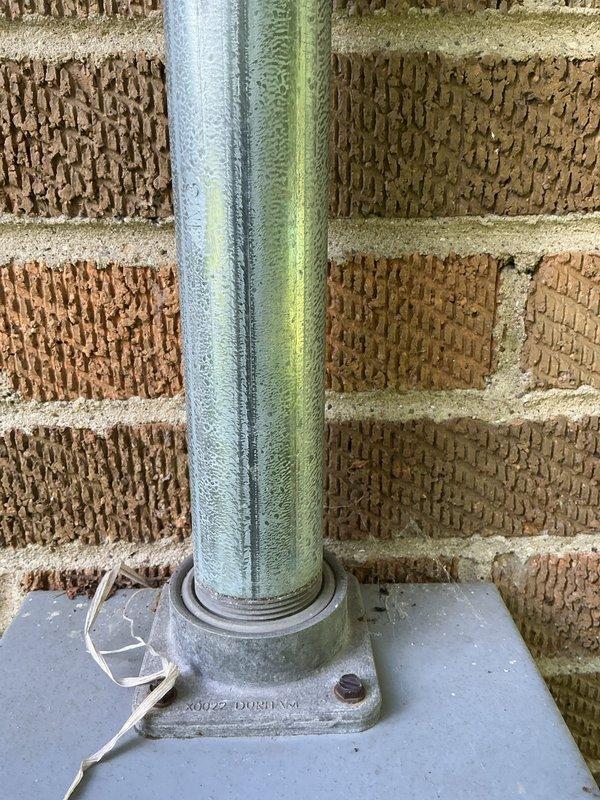 Completed electrical box replacement at residential property. Replaced existing weathered exterior meter enclosure and associated conduit showing significant oxidation and environmental degradation. Installed new meter housing with proper grounding and secure conduit connections to maintain utility service integrity and code compliance.