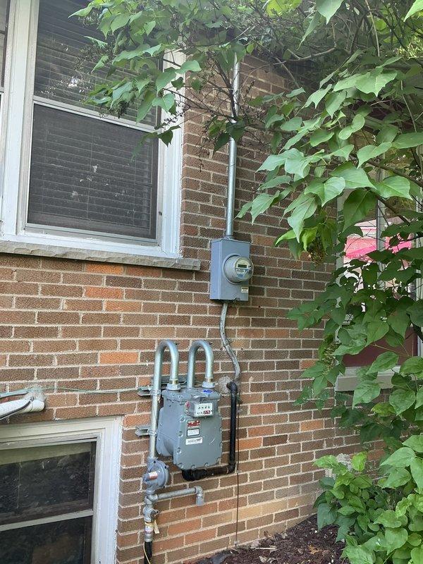 Completed electrical box replacement at residential property. Replaced existing weathered exterior meter enclosure and associated conduit showing significant oxidation and environmental degradation. Installed new meter housing with proper grounding and secure conduit connections to maintain utility service integrity and code compliance.