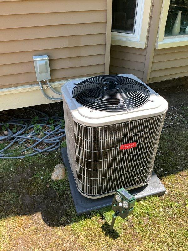 Completed comprehensive Gold AC inspection on 4-year-old residential split-system air conditioning unit with air handler located in basement. Performed thorough evaluation of outdoor condenser unit positioned on composite pad against home exterior, inspecting copper refrigerant lines, electrical connections, and overall equipment operation. Examined interior electrical components including dual-run capacitor (Totaline P291-45, 45+5 MFD) showing normal aging characteristics, contactor assembly, and associated wiring connections within control panel. Verified proper equipment operation, assessed component condition, and documented system status through photographic records. Unit found operational with all major components functioning within normal parameters for equipment age.