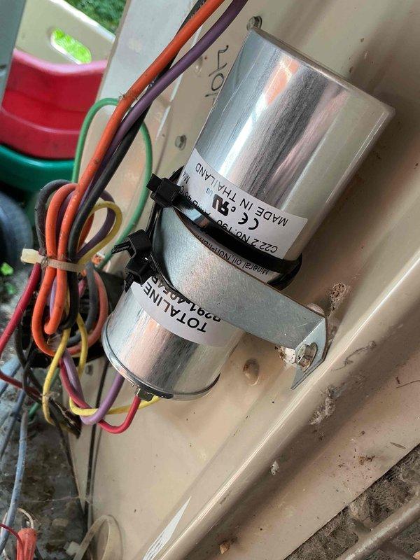 Completed comprehensive Gold AC Inspection on 10-year-old basement HVAC system. Performed thorough examination of indoor air handler electrical components, including dual-rated capacitor assembly (15/5 MFD) with proper wire connections and secure mounting. Inspected outdoor condensing unit and evaluated run capacitor condition, noting significant surface oxidation and weathering consistent with unit age. All electrical connections verified secure, system operational parameters checked, and photographic documentation captured for service records.