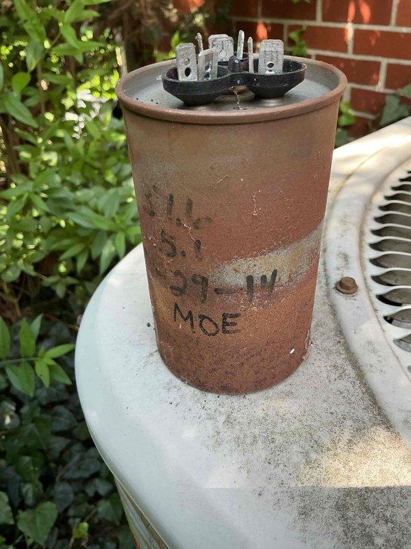 Completed comprehensive Gold AC Inspection on 10-year-old basement HVAC system. Performed thorough examination of indoor air handler electrical components, including dual-rated capacitor assembly (15/5 MFD) with proper wire connections and secure mounting. Inspected outdoor condensing unit and evaluated run capacitor condition, noting significant surface oxidation and weathering consistent with unit age. All electrical connections verified secure, system operational parameters checked, and photographic documentation captured for service records.