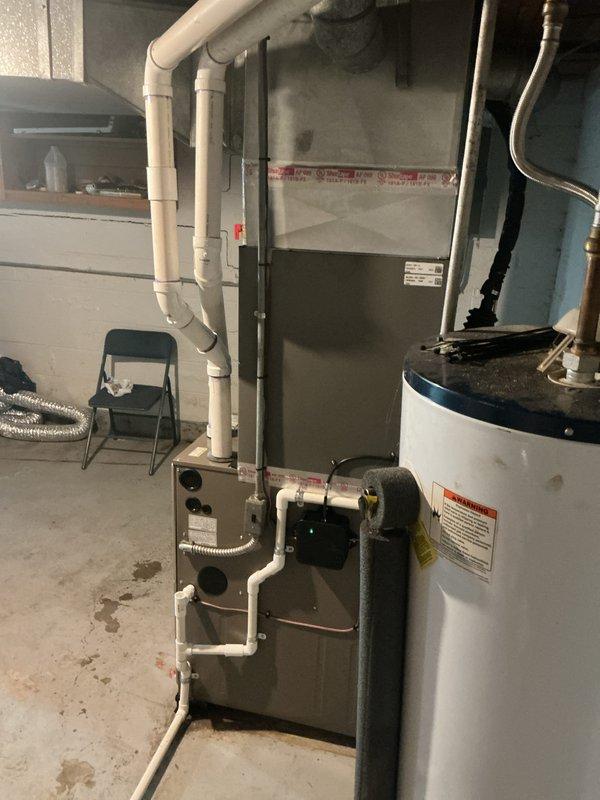 Completed installation of 2.5-ton air conditioning unit with matching evaporator coil in residential basement location. System was installed per manufacturer specifications, refrigerant lines were connected, electrical wiring completed, condensate drain established, and unit tested for proper operation. AC permit was requested for mechanical installation, all connections verified, and system commissioned successfully with customer payment received upon completion.