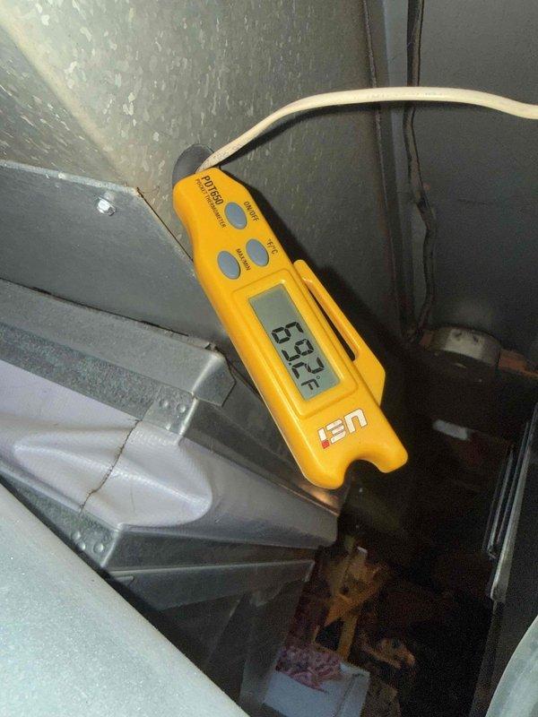 Completed comprehensive Gold AC Tune-Up on 10-year-old air conditioning system. Performed thorough inspection of electrical connections, contactors, and terminal blocks, verifying all wire terminations were secure and properly torqued. Measured supply air temperature at 65.3°F using calibrated digital thermometer to confirm system operation. Cleaned accumulated dust and debris from electrical components and enclosure, inspected condenser unit located at rear of property, checked refrigerant levels, and verified proper system cycling and performance parameters are within manufacturer specifications.