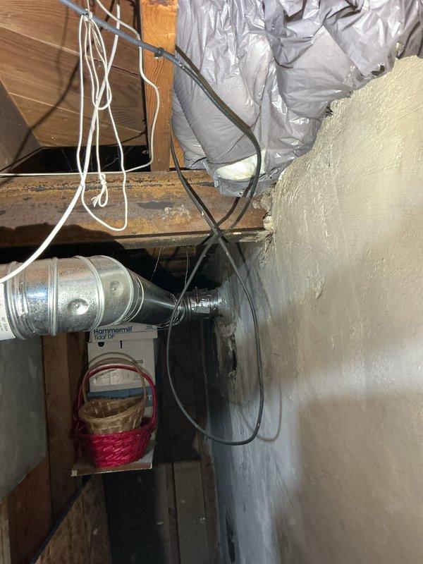 Installed 40-gallon short tanked water heater in basement utility area with proper B-vent exhaust system and drip pan for secondary protection. Connected copper supply lines with brass fittings and valves, established humidifier line integration, and verified all plumbing connections for proper operation. Unit mounted on concrete floor with metallic ductwork properly secured, all manufacturer specifications met, and system tested for safe operation.