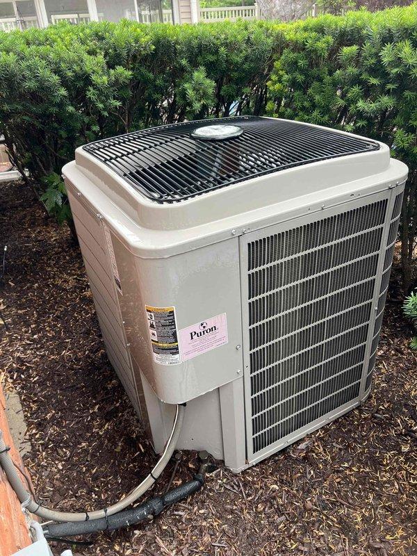 Completed comprehensive Gold AC Inspection on a 15-year-old outdoor condensing unit utilizing Puron refrigerant. Performed full system tune-up including cleaning condenser coils, inspecting electrical connections, checking refrigerant levels, testing capacitor and contactor operation, verifying proper airflow across heat exchanger fins, and ensuring all safety controls functioned correctly. Unit operating within manufacturer specifications upon completion of maintenance service.