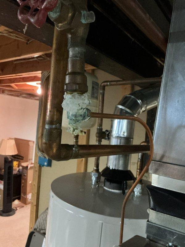 # HVAC Maintenance - Gold AC Inspection

Performed comprehensive Gold AC Inspection on Carrier outdoor condensing unit of unknown age. Conducted complete system evaluation including visual inspection of condenser cabinet, coils, and electrical components. Verified proper operation of compressor and condenser fan motor. Inspected electrical disconnect box and associated wiring for safety compliance. Checked refrigerant line insulation integrity and conduit connections at exterior wall penetration. Evaluated condenser pad levelness and unit stability on concrete base.

Measured temperature differential across evaporator coil and verified proper airflow through system. Inspected indoor evaporator coil and associated copper refrigerant lines in basement mechanical area. Noted presence of condensation or frost formation on U-bend piping configuration near water heater, indicating potential low refrigerant charge or airflow restriction. Examined brass fittings, joints, and pressure relief co