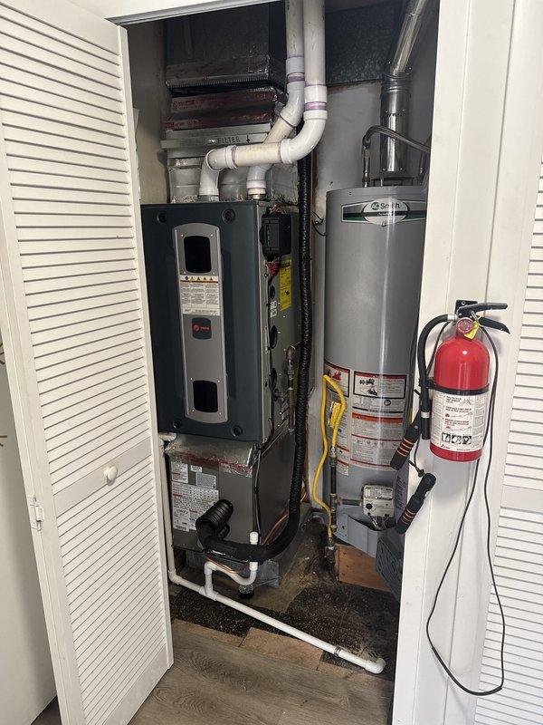 Successfully completed full-day installation of new air conditioning system and evaporator coil. Installed A/C condenser unit and matching indoor coil, with equipment positioned in attic utility space. Connected new flexible ductwork to air handler unit, installed condensate drain lines using PVC piping with proper slope and routing. Integrated new coil with existing furnace system in utility closet configuration. Verified all electrical connections, refrigerant lines, and drainage systems for proper operation. System tested and confirmed operational. Permit requested for installation compliance.