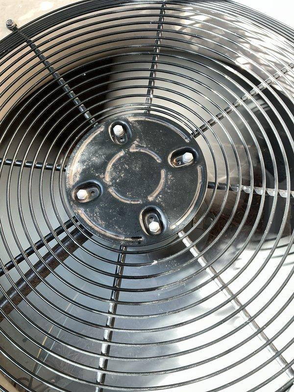 Completed Gold-level preventive maintenance inspection on two air conditioning systems: an 8-year-old unit and a 10+ year-old unit with coil located in basement. Both systems were operational at time of service. Performed comprehensive inspection of outdoor condenser units, including visual assessment of fan assemblies, protective grilles, and housing conditions. Documented extensive weathering and paint deterioration on exterior surfaces of rooftop-mounted unit, with significant peeling and flaking noted on housing while structural components and fan guard remained intact. Verified proper fan operation and airflow on both condensing units. All systems confirmed functioning within normal operating parameters upon completion of inspection.