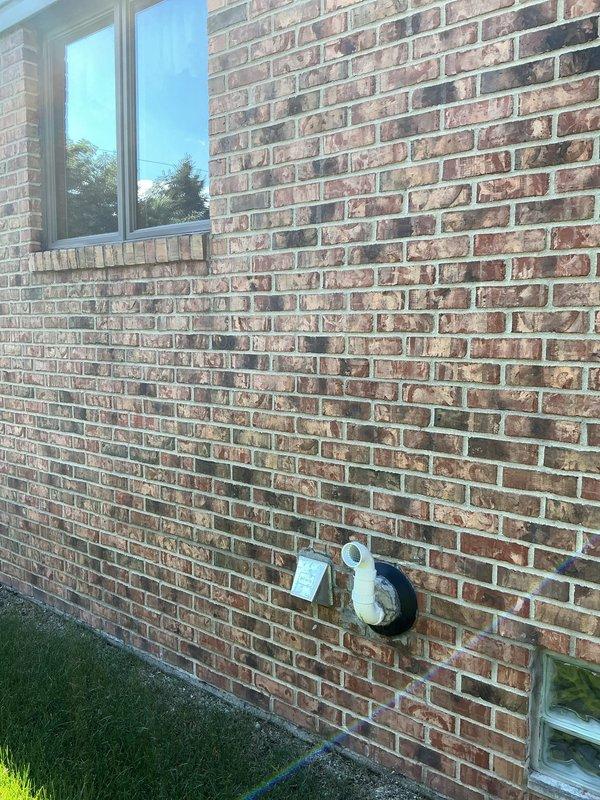 Responded to building code violation regarding tankless water heater exhaust termination positioned too close to operable window. Modified exterior 2" PVC exhaust vent pipe by cutting to proper length and installing elbow fitting with plastic screen insert to achieve required 4-foot clearance from window opening. Final inspection requested for code compliance approval and permit closure.