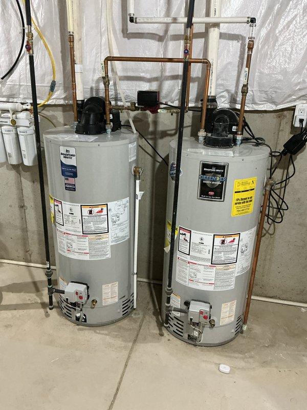 Completed comprehensive Gold AC inspection on an 11-year-old Goodman air conditioning system with basement-located air handler. Performed thorough multi-point evaluation of outdoor condenser unit, inspecting fan motor operation, electrical connections, refrigerant lines, and overall unit condition. Verified proper airflow through coil fins and checked for any signs of refrigerant leaks or component deterioration. Inspected basement air handler and coil assembly, examining drain line functionality, blower motor operation, and filter condition. Tested system operation and confirmed adequate cooling performance within acceptable parameters. Documented equipment condition with photographic evidence showing outdoor condenser unit positioned on gravel pad with proper clearances and basement mechanical room setup including dual water heaters and HVAC components. System operating as designed with no immediate service needs identified at time of inspection.