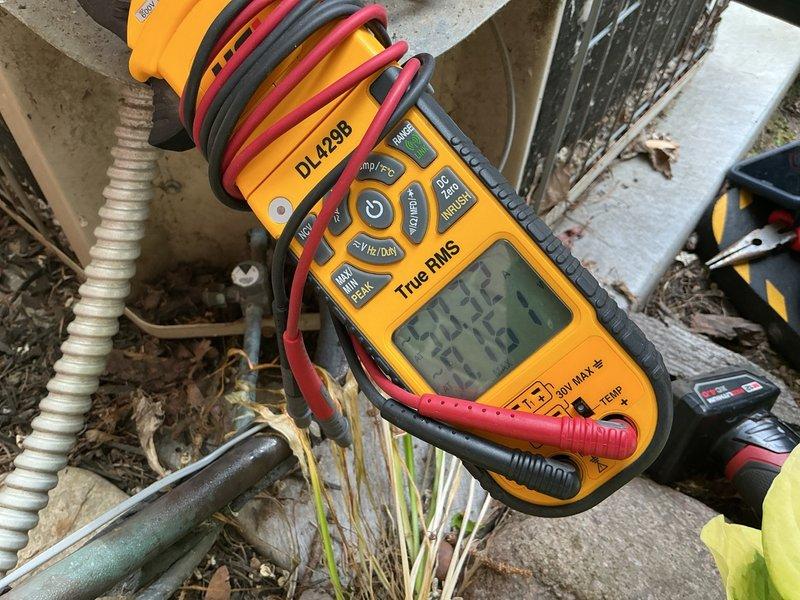 Completed comprehensive tune-up inspection on 15-year-old outdoor air conditioning condenser unit. Performed diagnostic testing using digital multimeter to verify electrical components, checked refrigerant lines, inspected condenser coils and fan operation, and evaluated overall system performance. Additionally inspected basement equipment including humidifier, thermostat, and hot water tank to ensure proper operation of all HVAC and related systems.