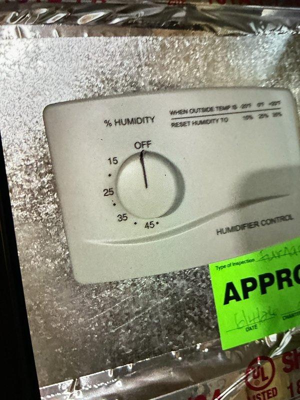 Performed comprehensive air conditioning maintenance and inspection on residential cooling system. Evaluated humidifier control settings and verified proper humidity level configuration based on outdoor temperature parameters. Documented existing water heater installation and associated plumbing connections during system assessment, noting equipment conditions and component functionality for maintenance records.