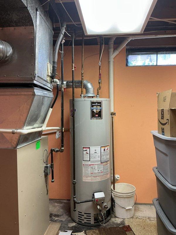 Completed full replacement installation of 40-gallon gas water heater due to faulty gas valve preventing hot water production. Installed new unit with drip pan and alarm system for leak detection and safety compliance. Reconnected all gas lines, water supply connections, and venting system to manufacturer specifications, restoring full hot water service to the property.