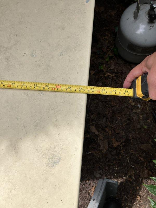 Conducted electrical estimate for whole home generator replacement at residential property. Assessed existing generator installation including propane fuel line connections, mounting pad dimensions, and equipment placement in exterior location. Documented current system configuration with measurements of concrete pad and photographed existing piping connections to prepare comprehensive replacement proposal.