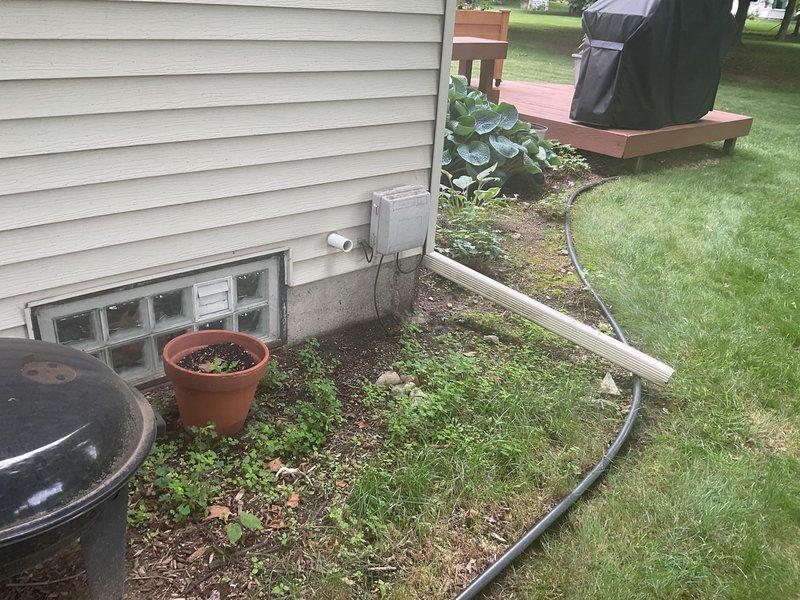 Conducted on-site assessment for sump pump pit installation in 47-year-old residential basement with existing sump pump system in northeast corner. Evaluated current basement conditions, including storage area configuration, HVAC ductwork placement, and foundation structure with glass block window. Inspected exterior discharge point location near foundation, noting landscaped garden bed with metal edging and proximity to deck structure. Documented existing sump pump setup, basement utility access, and potential installation parameters for new pit system. Provided comprehensive estimate for sump pump pit installation project, including assessment of workspace clearances, discharge routing options, and integration with current basement infrastructure.