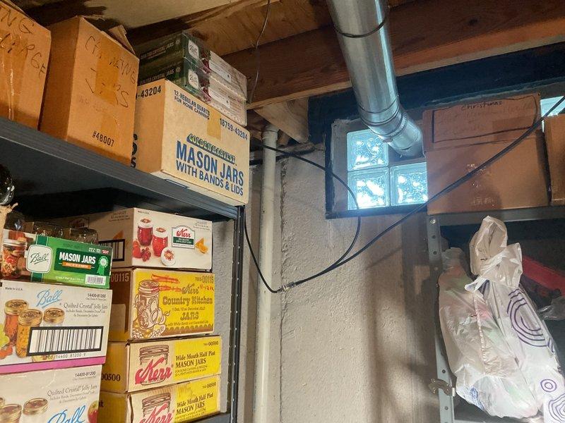 Conducted on-site assessment for sump pump pit installation in 47-year-old residential basement with existing sump pump system in northeast corner. Evaluated current basement conditions, including storage area configuration, HVAC ductwork placement, and foundation structure with glass block window. Inspected exterior discharge point location near foundation, noting landscaped garden bed with metal edging and proximity to deck structure. Documented existing sump pump setup, basement utility access, and potential installation parameters for new pit system. Provided comprehensive estimate for sump pump pit installation project, including assessment of workspace clearances, discharge routing options, and integration with current basement infrastructure.