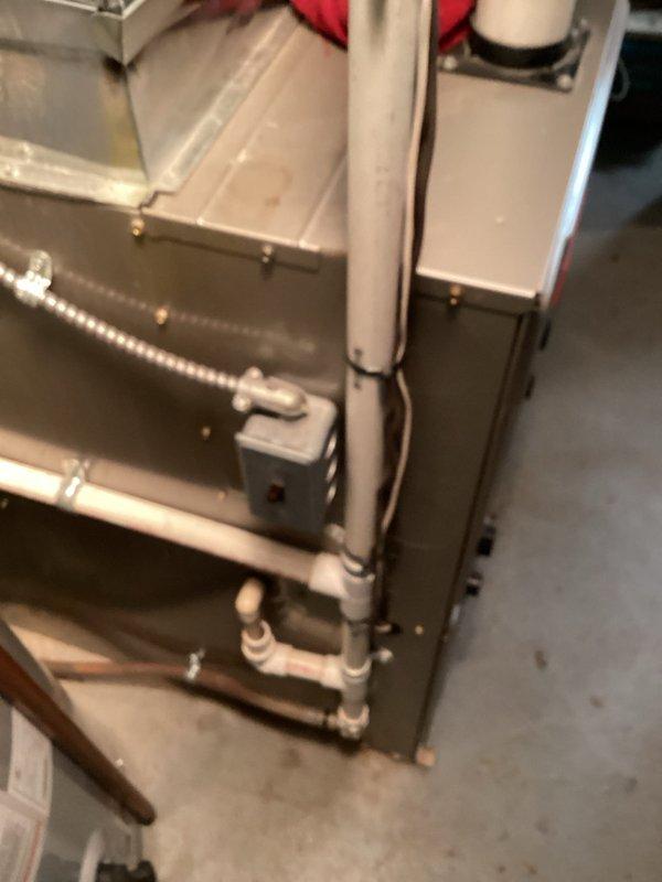 Performed diagnostic evaluation on 22-year-old air conditioning system with reported cooling issues and damaged refrigerant line insulation. Upon inspection, confirmed system was low on R22 refrigerant and assessed overall condition of aging equipment. Documented thermostat operation and indoor furnace unit with associated ductwork and piping. Provided estimate for system replacement due to age of equipment, refrigerant type, and extent of repairs needed to restore proper operation.