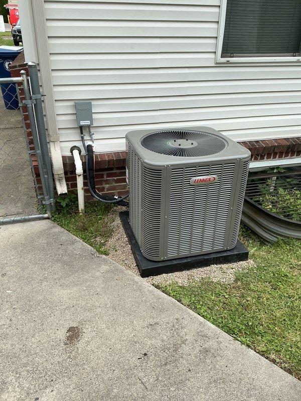 Completed full installation of new Lennox air conditioning system including outdoor condensing unit and indoor evaporator coil. Relocated condensing unit to new position on concrete pad with proper clearances, installed refrigerant lines, condensate drainage, and electrical disconnect. System was evacuated, charged to manufacturer specifications, and tested with digital manifold gauges confirming proper refrigerant pressures of 194 PSIG on low side and 233.3 PSIG on high side with acceptable superheat and subcooling readings. Permit was requested for installation and electrician will be required for final electrical connections.