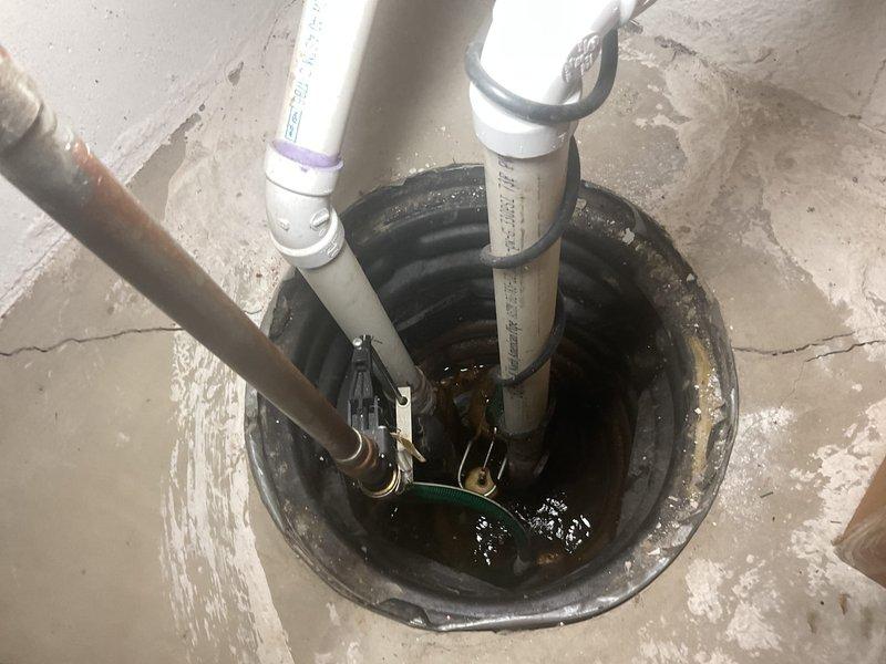 Responded to service call for sump pump with water continuously running in basin. Upon inspection, found sump pump float switch mechanism malfunctioning, causing pump to cycle improperly and preventing automatic shutoff. Tested pump operation and confirmed float switch was stuck in activation position due to debris accumulation. Cleaned sump basin of sediment and debris, freed float switch mechanism, and verified proper float travel range. Tested pump through multiple cycles to ensure proper activation at correct water levels and automatic shutoff functionality. Confirmed discharge piping and check valve operating correctly with no backflow issues. System now cycling properly with appropriate on/off intervals based on water level.