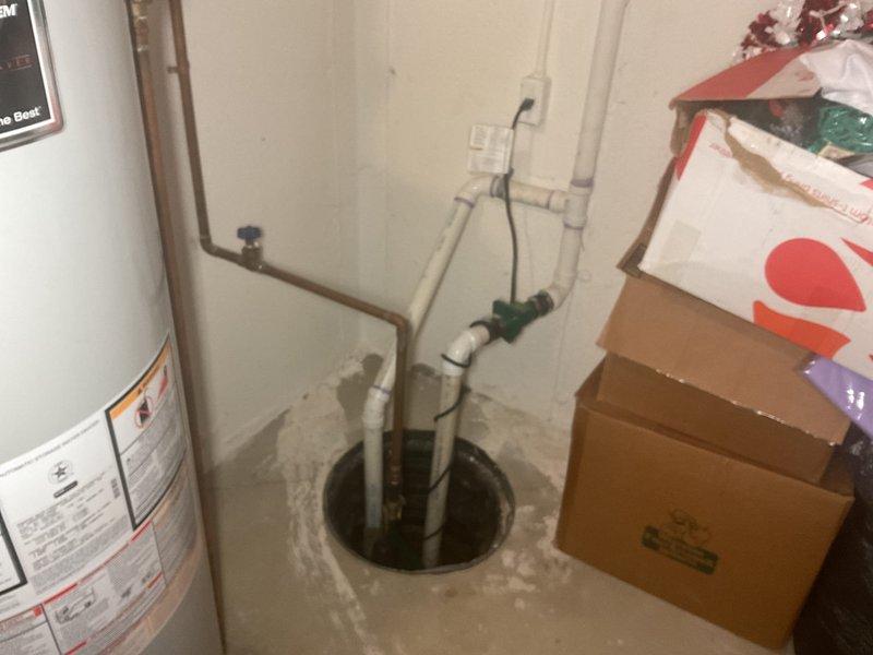 Responded to service call for sump pump with water continuously running in basin. Upon inspection, found sump pump float switch mechanism malfunctioning, causing pump to cycle improperly and preventing automatic shutoff. Tested pump operation and confirmed float switch was stuck in activation position due to debris accumulation. Cleaned sump basin of sediment and debris, freed float switch mechanism, and verified proper float travel range. Tested pump through multiple cycles to ensure proper activation at correct water levels and automatic shutoff functionality. Confirmed discharge piping and check valve operating correctly with no backflow issues. System now cycling properly with appropriate on/off intervals based on water level.
