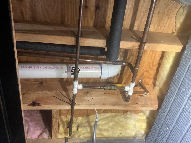 Responded to master bathroom toilet seal failure in 35-year-old residence where issue had persisted for over one week. Accessed plumbing system through ceiling cavity below fixture, inspecting PVC drainage lines, copper supply lines, and wax ring seal at floor flange. Replaced deteriorated wax ring seal and reinstalled toilet to manufacturer specifications, ensuring proper compression and watertight connection. Verified all connections for leaks, confirmed proper bowl operation, and documented pre-repair and post-access conditions with photographic evidence of work area and exposed plumbing infrastructure.