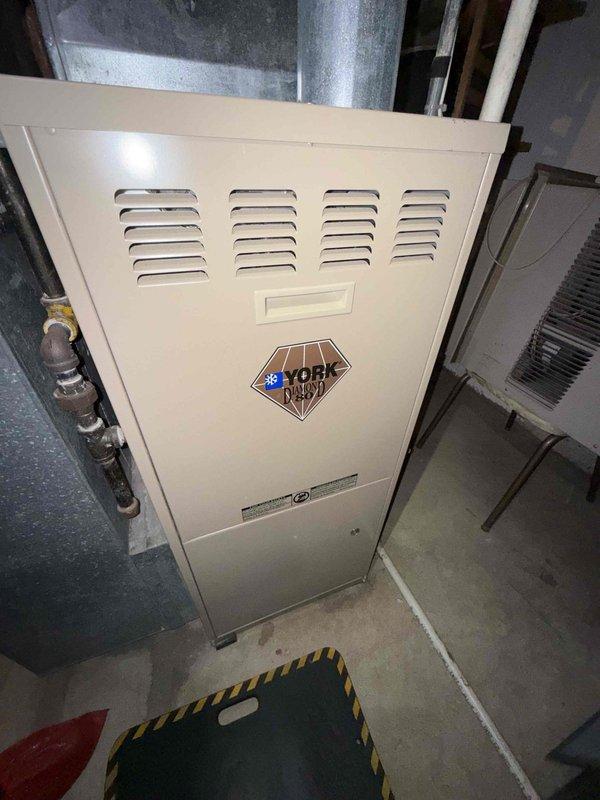 Responded to no cooling complaint on 10+ year old York cooling system located in basement. Upon inspection, discovered severe corrosion and deterioration of internal components, including metal fittings, pipes, and connections showing extensive oxidation, mineral deposits, and surface degradation. Thermostat malfunction attributed to system age and compromised components. Documented condition with inspection camera revealing advanced corrosion throughout affected areas. Advised customer of findings and recommended system replacement due to extent of deterioration and age of equipment.