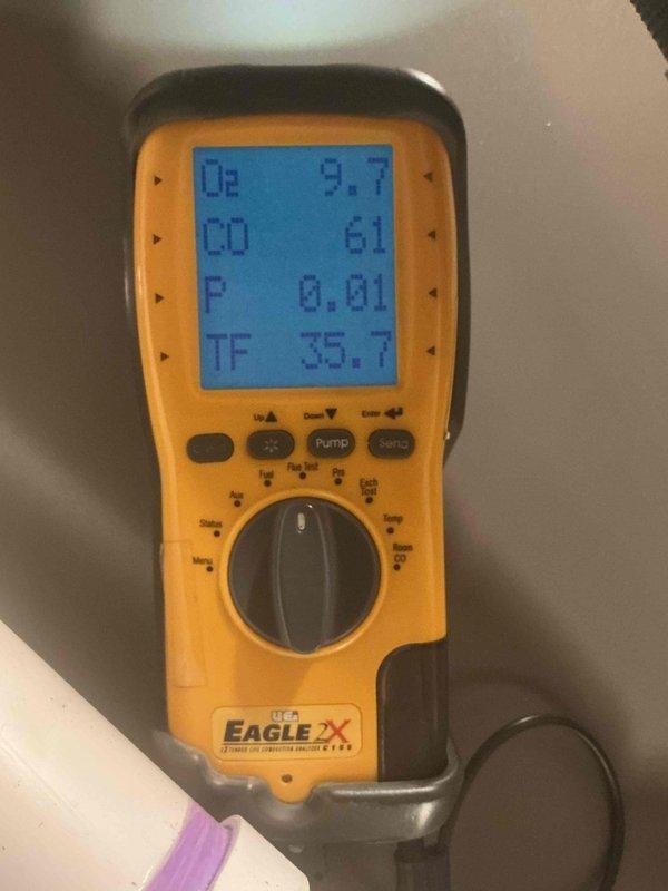 Completed comprehensive Gold AC inspection on multi-unit system including one-year-old Lennox air conditioning unit and four-year-old furnace with basement coil location. Performed full system diagnostics including combustion analysis readings showing oxygen levels at 9.7%, carbon monoxide at 61 PPM, and temperature readings at 75.1°F. Inspected outdoor condensing unit confirming proper operation, clean coils, secure refrigerant lines, and overall excellent equipment condition with no visible damage or excessive wear.