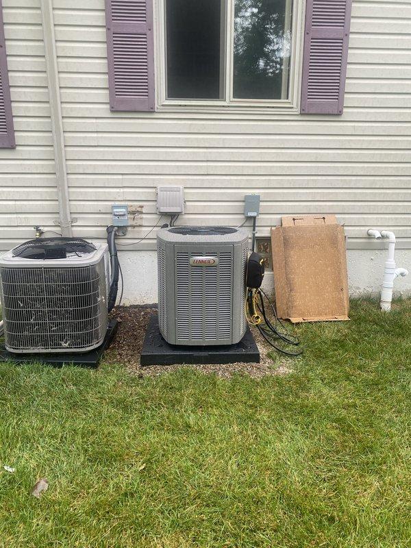 Completed full HVAC system installation including a 70,000 BTU furnace and 2-ton air conditioning unit with rear discharge configuration. Installed Ecobee 3 Lite thermostat, reconnected existing humidifier, and ran new condensate drain lines with proper PVC termination through exterior wall. Mounted new Lennox condenser unit on composite pad with weatherproof electrical disconnect box, completed all electrical connections, and ensured proper refrigerant charge. System tested and operational, meeting AHRI certification 215566314 standards and qualifying for applicable utility rebates.