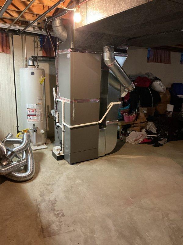 Completed full HVAC system installation including 90,000 BTU furnace and 4-ton air conditioning unit with rear discharge configuration. Installed humidifier, liner, and condensate pump, performed all necessary ductwork connections, and reconnected existing equipment. Obtained mechanical permit, completed remeasure verification, and documented AHRI certificate number for utility rebate processing.