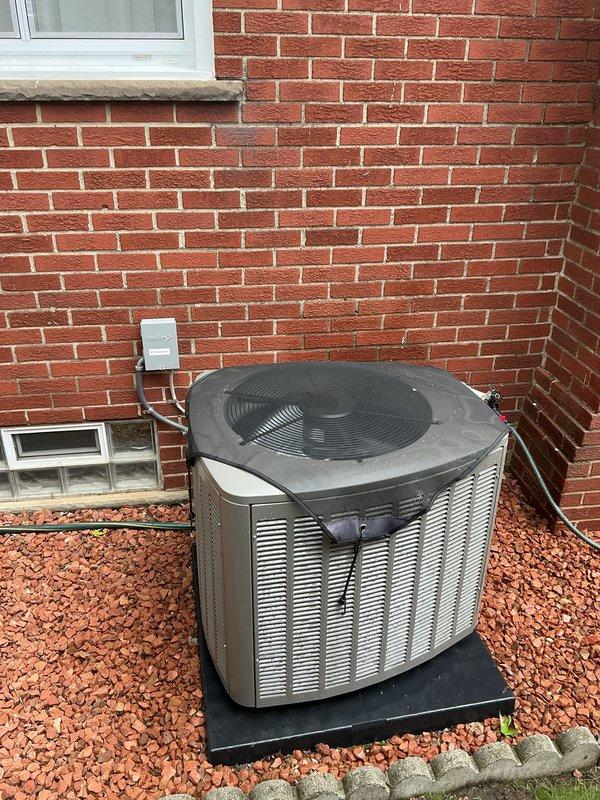 Completed Gold AC inspection on a 1-year-old system with outdoor condensing unit and basement air handler. Verified proper operation of all components, inspected Honeywell ProSeries thermostat functionality, examined outdoor unit condition including fan operation and coil cleanliness, and confirmed refrigerant lines and electrical connections were secure. System operating within normal parameters with no deficiencies noted.