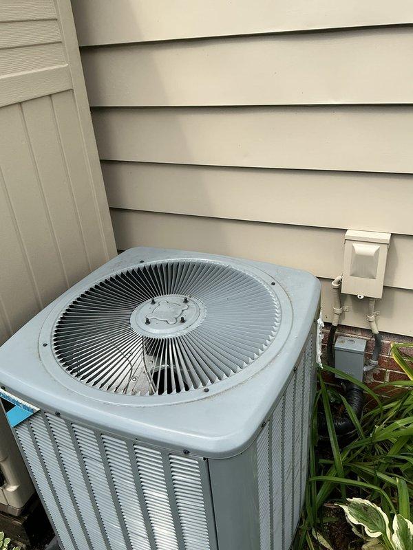 Responded to no cooling complaint on 5-year-old residential air conditioning system with blower fan malfunction. Inspected basement-located equipment and outdoor condensing unit, verified thermostat settings at 72°F cooling mode, and documented system configuration. Diagnosed blower motor failure preventing air circulation through the system, resulting in complete loss of cooling capacity.