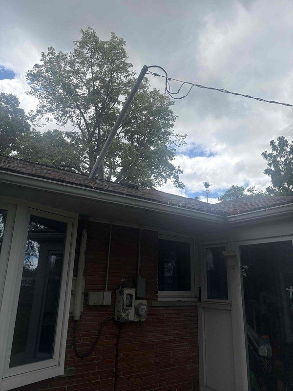Responded to a no-power service call where the overhead electrical service line had detached from the residence. Reconnected and secured the service drop line to the exterior weatherhead mounting point on the brick structure, restoring proper connection between the utility supply and the home's electrical service entrance. Verified proper tension on the service conductors, inspected the meter base and main disconnect panel for any damage from the line displacement, and confirmed full power restoration to all circuits throughout the residence.