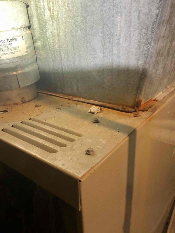 Completed AC tune-up on basement-located system with customer complaint of inadequate cooling. Performed comprehensive inspection revealing significant condensation accumulation on ductwork and dust buildup on unit components, indicating potential airflow restrictions and drainage concerns. Cleaned accessible components, verified system operation, and addressed moisture issues to restore proper cooling function.