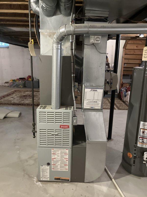 Provided comprehensive replacement estimate for natural gas furnace system located in basement. Current Bryant unit is over 10 years old and operational but customer seeking replacement options. Assessed existing HVAC infrastructure including ductwork connections, electrical panel capacity, and ventilation routing to determine optimal replacement specifications and installation requirements.