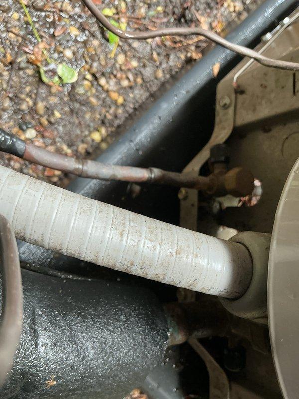 Completed yearly air conditioning tune-up and inspection on a 5-year-old outdoor condensing unit. Performed comprehensive system evaluation including refrigerant line inspection, electrical disconnect examination, and visual assessment of all accessible components. Unit operational with no immediate repairs required; documented equipment condition with photographic records showing normal wear consistent with age and outdoor exposure.