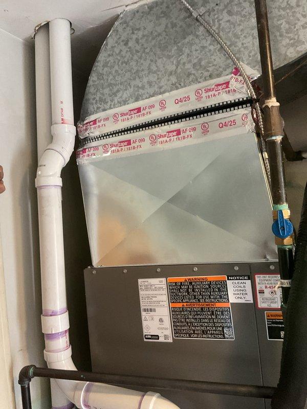 Completed full HVAC system installation including 90,000 BTU furnace and 3-ton air conditioning unit in rear yard location. Installed air handler in attic space with proper ductwork connections, refrigerant lines with service ports, and PVC condensate drainage. Added humidifier integration and verified all electrical connections, control boards, and safety systems. Requested mechanical and electrical permits, completed system startup, and registered equipment for available utility rebates under AHRI certification 216722098.