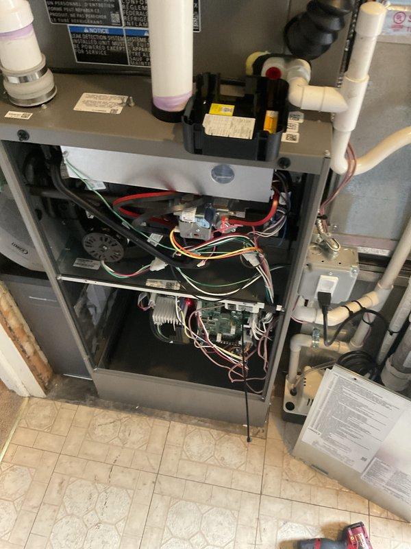 Completed full HVAC system installation including 90,000 BTU furnace and 3-ton air conditioning unit in rear yard location. Installed air handler in attic space with proper ductwork connections, refrigerant lines with service ports, and PVC condensate drainage. Added humidifier integration and verified all electrical connections, control boards, and safety systems. Requested mechanical and electrical permits, completed system startup, and registered equipment for available utility rebates under AHRI certification 216722098.